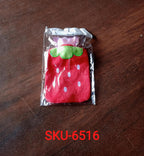 Strawberry print hot water bottle, highlighting its secure cap and durable material.