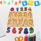 Toddler happily playing with a colorful wooden number puzzle board.