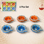 Intricate peacock design on a hand-painted clay diya, showcasing traditional Indian artistry.