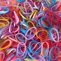 Multicolor elastic rubber bands neatly organized for office and home use.