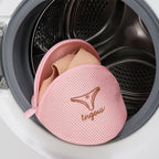 Lingerie wash bag with a bra inside, demonstrating its protective capacity.