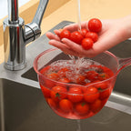 Clear plastic utility bowl used in home kitchen for washing