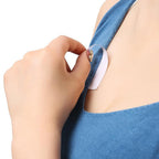 Clear double-sided tape applied to a delicate fabric, demonstrating its strong, discreet hold.