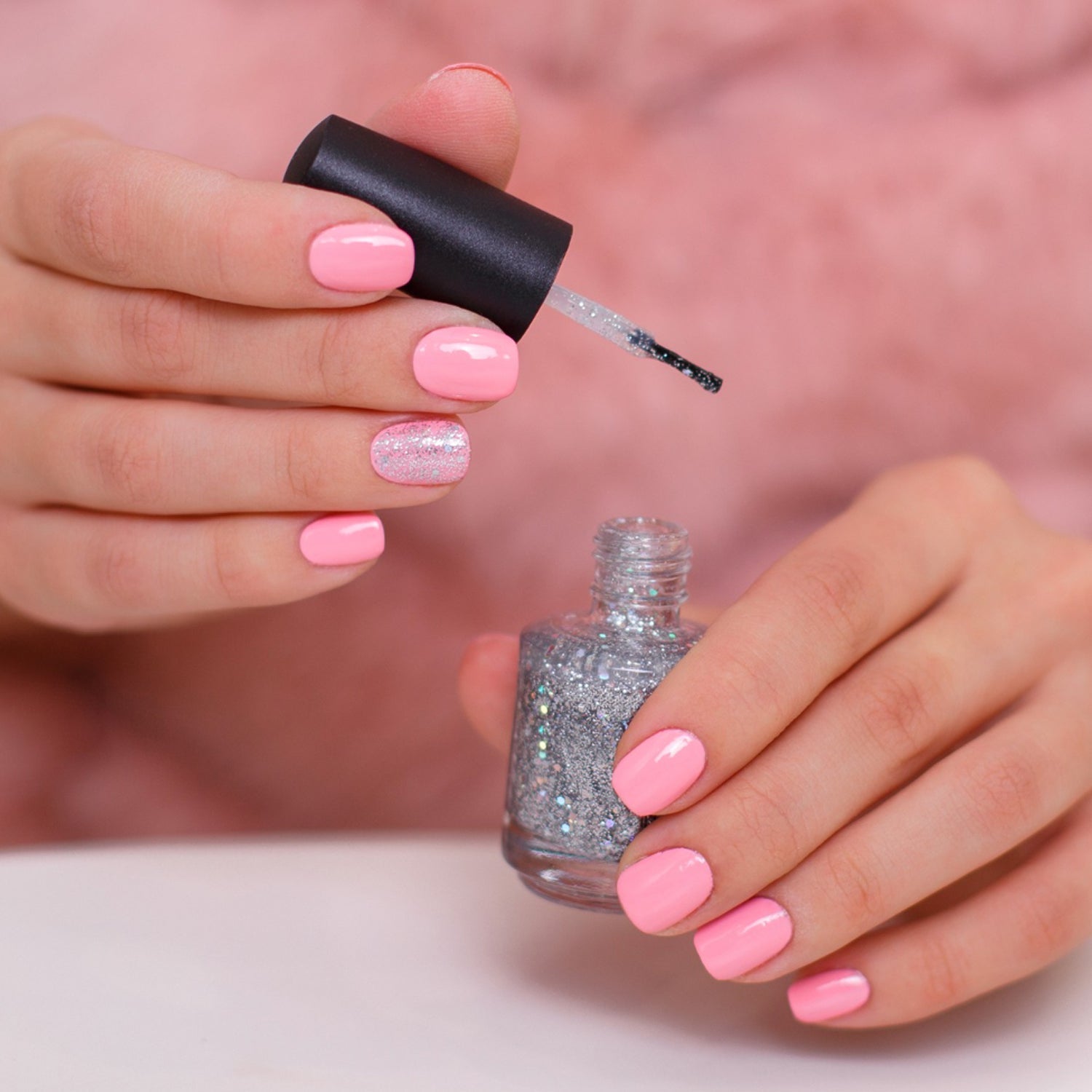Glossy mini nail polish bottle showing smooth glitter finish