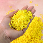 Bright orange elastic rubber bands bundled together