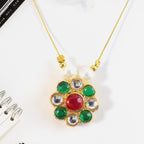 Side angle of multicolor stone floral pendant featuring pearl bead details