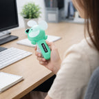 Smooth rotating blades of mini handheld fan for quiet airflow
