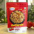 A hand holding a bowl of Maniarr's Tomato Roasted Multigrain Mixture, perfect for on-the-go snacking.
