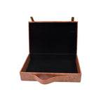 Detail shot of the sturdy handle and stitching on the ClassiCarry leather case.