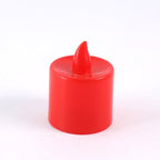 Hand holding a red battery operated LED tea light, demonstrating its portable size.