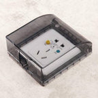 Detailed shot of the easy-to-install clear electrical outlet protector.