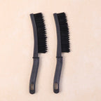 Close-up of long handle brush head cleaning narrow window track edges