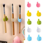 Colorful WipeTech cable clips organizing wires on a desk.