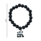Stylish pastel bead stretch bracelet laid flat highlighting glossy finish and charm