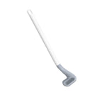 Set of colorful golf toilet brushes with their wall-mounted holders.
