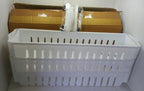 The space-saving organizer placed beside a washing machine, holding laundry essentials.