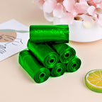 Roll of green compostable garbage bags (17x19) for sustainable waste disposal.