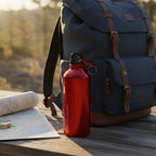 Small reusable water bottle suited for desk use and travel hydration