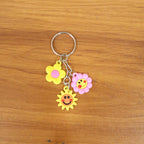 Flower cartoon keychain adding cheerful design to a backpack