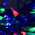 Multi-color LED string light displaying energy-efficient bulbs on flexible wire
