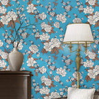 Applied floral wallpaper roll on wall showcasing vibrant pattern
