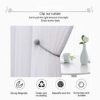 Magnetic curtain holdback with its two magnetic balls snapped together.