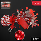 Close-up of red LED bulbs on decorative fairy string lights