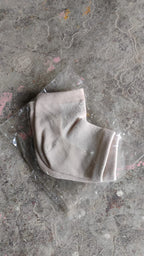 Instructional image showing how to wear the heel socks for best results.