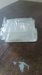 Weatherproof outlet protector securely mounted on an exterior wall.