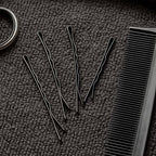 Detailed close-up of black bobby pin with smooth tips